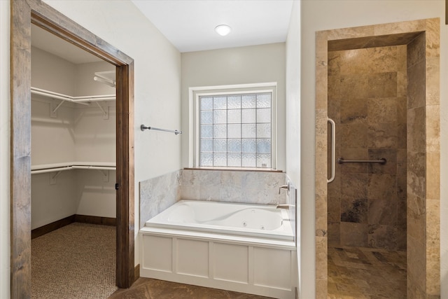 bathroom featuring tile flooring and plus walk in shower