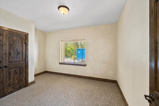 unfurnished bedroom featuring dark colored carpet