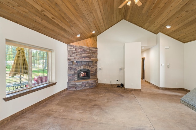 unfurnished living room featuring lofted ceiling, a stone fireplace, ceiling fan, and wooden ceiling