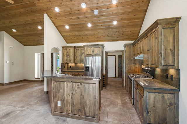 kitchen featuring backsplash, stainless steel appliances, a kitchen island with sink, and wood ceiling