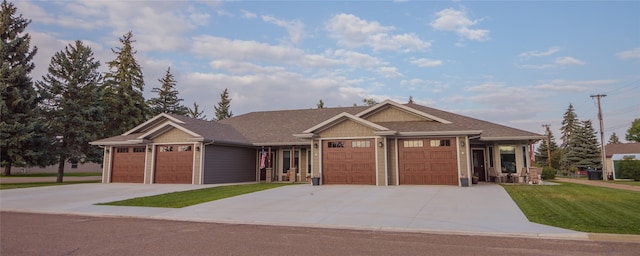 view of front of property featuring a garage and a front yard