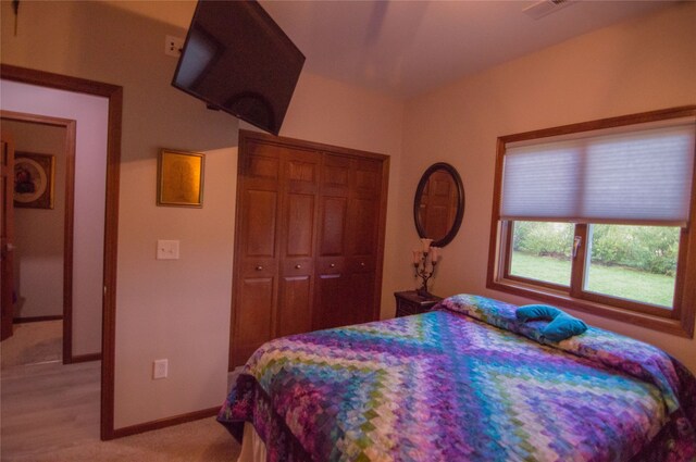 carpeted bedroom with a closet