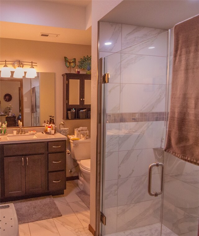 bathroom with vanity, an enclosed shower, tile patterned flooring, and toilet