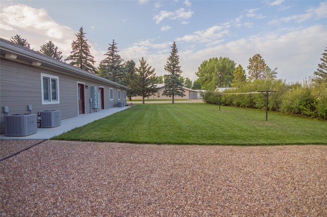 view of yard featuring central AC