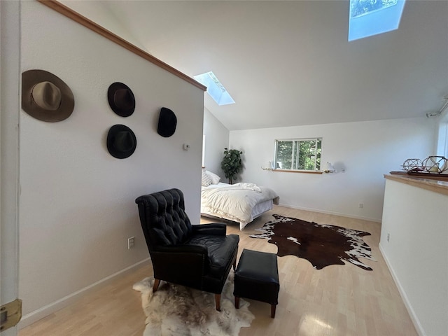 3971 Glen Lake Rd, Eureka, MT 59917 - bedroom with a skylight, wood finished floors, and lofted ceiling