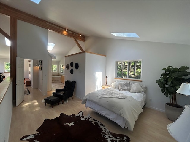 3971 Glen Lake Rd, Eureka, MT 59917 - bedroom with a skylight, light wood finished floors, and multiple windows
