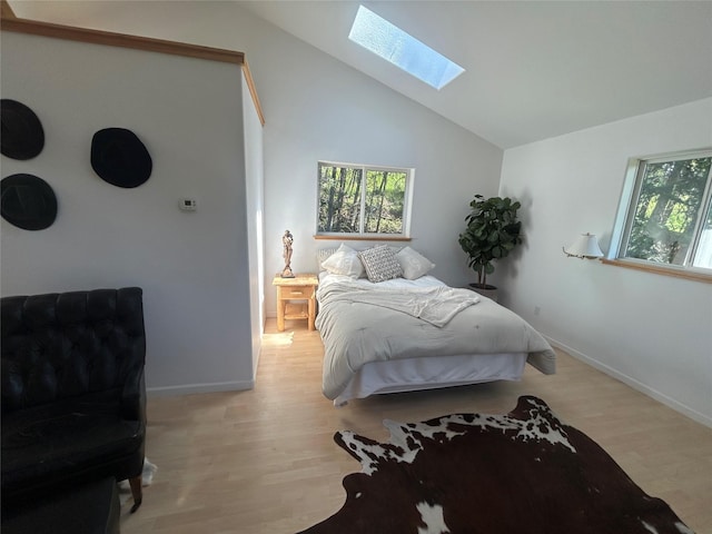 3971 Glen Lake Rd, Eureka, MT 59917 - bedroom featuring a skylight, wood finished floors, and lofted ceiling