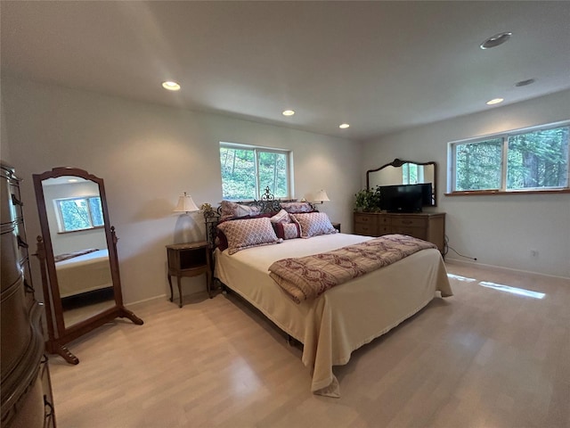 3971 Glen Lake Rd, Eureka, MT 59917 - bedroom with multiple windows, recessed lighting, and light wood-style flooring