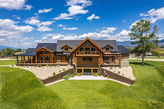 391 Skyline Dr, Hamilton, MT 59840 - back of house with log exterior, a yard, a patio, and a deck with mountain view