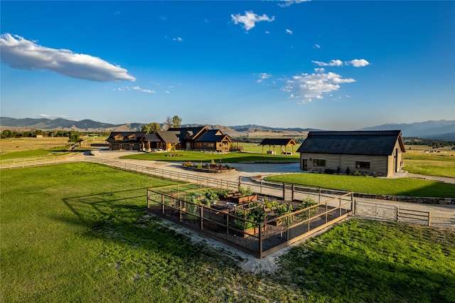 view of community featuring a yard and a mountain view