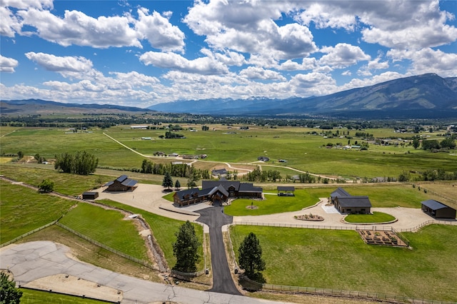 birds eye view of property with a mountain view and a rural view