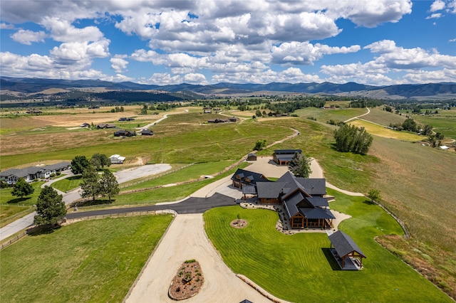 drone / aerial view with a mountain view and a rural view