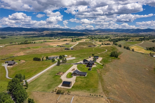 drone / aerial view with a mountain view and a rural view