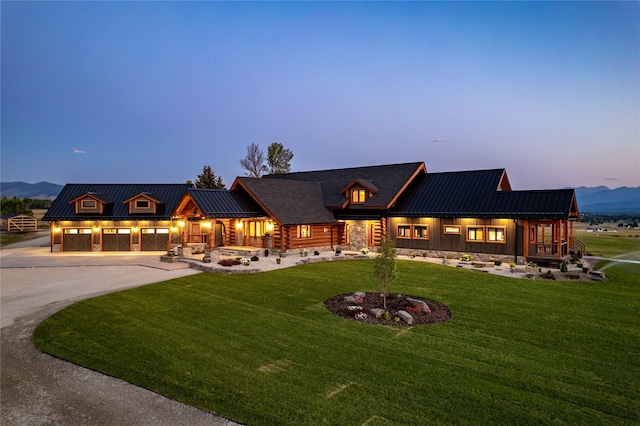 391 Skyline Dr, Hamilton, MT 59840 - view of front of home featuring curved driveway, a front lawn, metal roof, and a standing seam roof