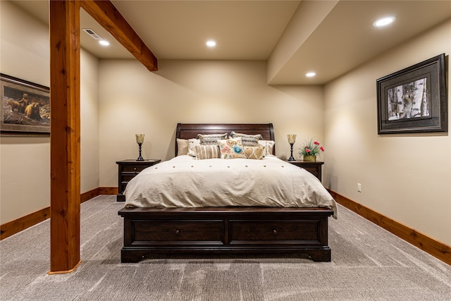 bedroom featuring carpet flooring and beam ceiling