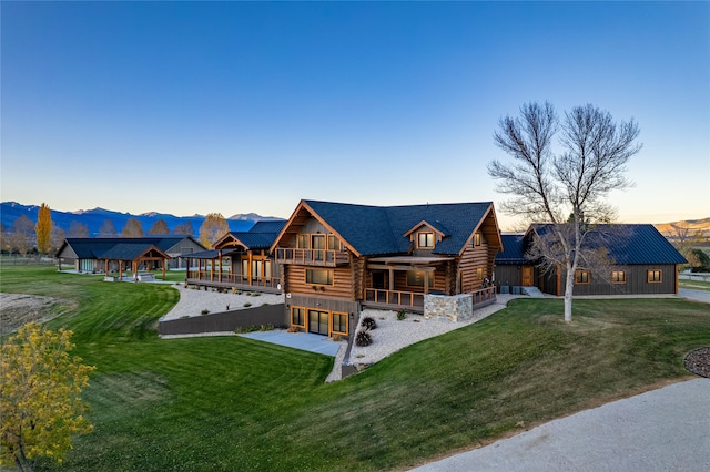 log-style house featuring a yard