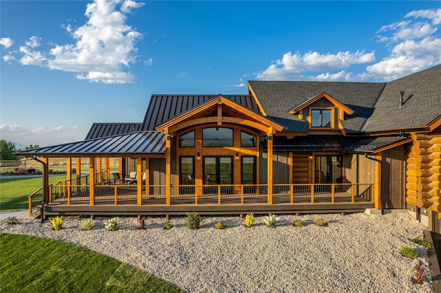 back of house with a yard and a wooden deck