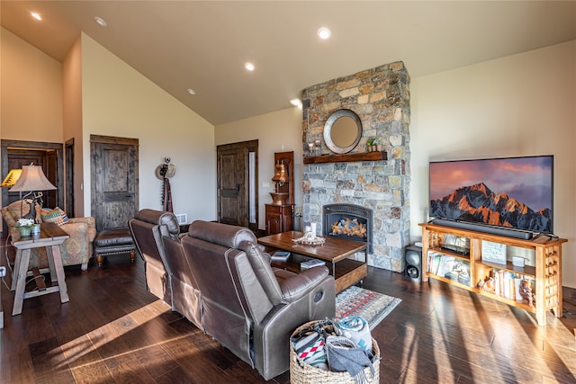 living room featuring a fireplace, vaulted ceiling, and hardwood / wood-style floors