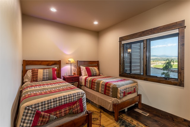 bedroom with hardwood / wood-style floors