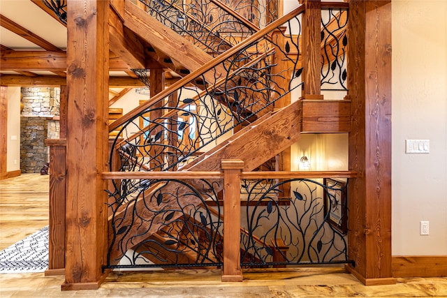 stairs with hardwood / wood-style flooring