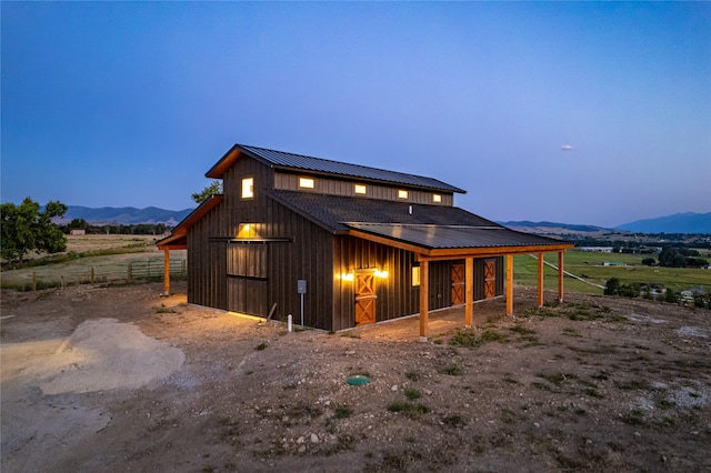 exterior space with a mountain view and an outdoor structure