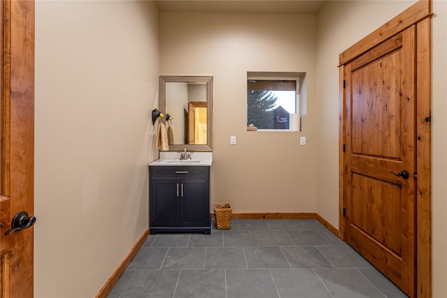 interior space featuring tile patterned flooring and vanity