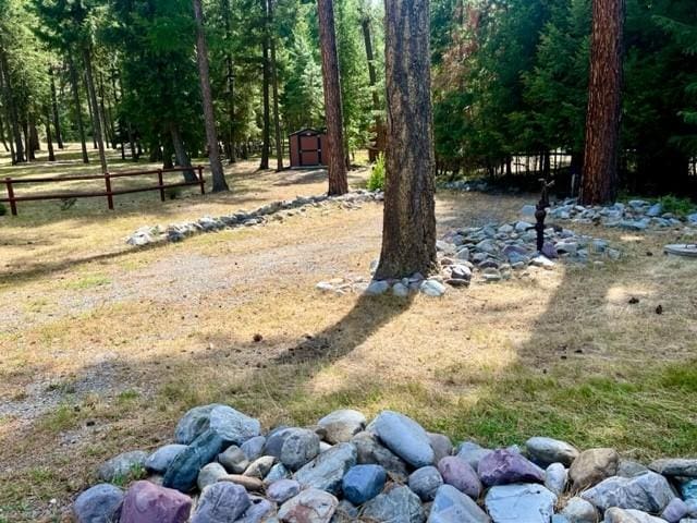 5 Osprey Dr E, Thompson Falls, MT 59873 - view of yard with a storage unit and a forest view