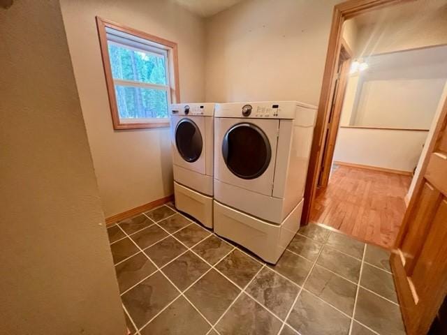 5 Osprey Dr E, Thompson Falls, MT 59873 - laundry area featuring washing machine and dryer and dark tile patterned floors