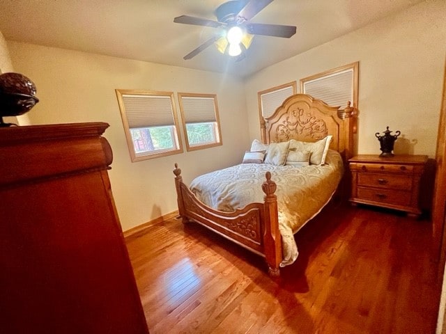 bedroom with hardwood / wood-style flooring and ceiling fan