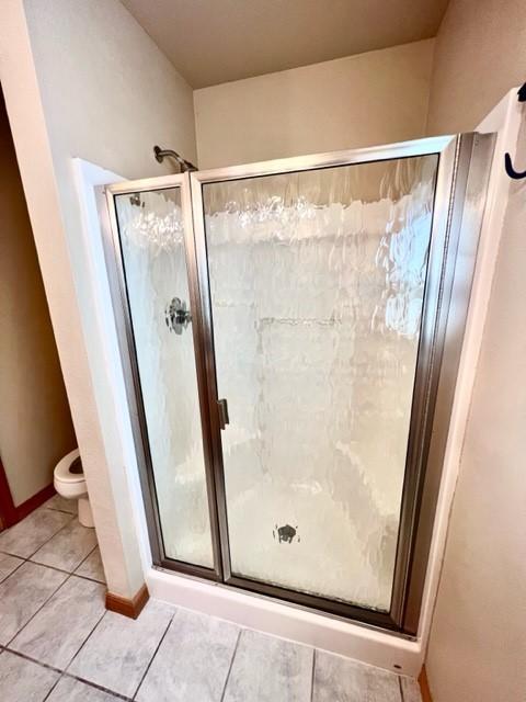 5 Osprey Dr E, Thompson Falls, MT 59873 - full bath with a stall shower and tile patterned floors