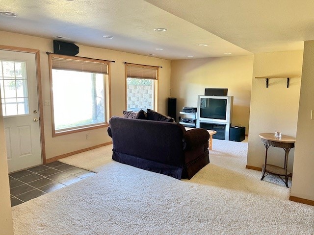 living room featuring tile floors and plenty of natural light