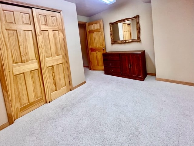 carpeted bedroom with a closet