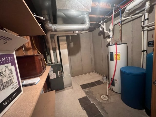 basement with tile flooring and electric water heater