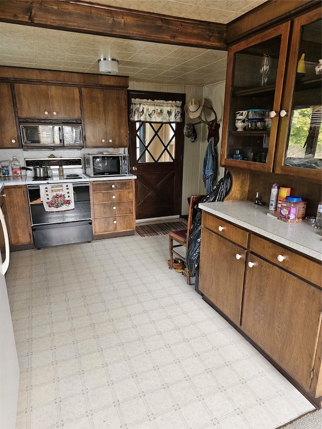 kitchen featuring white range with electric cooktop