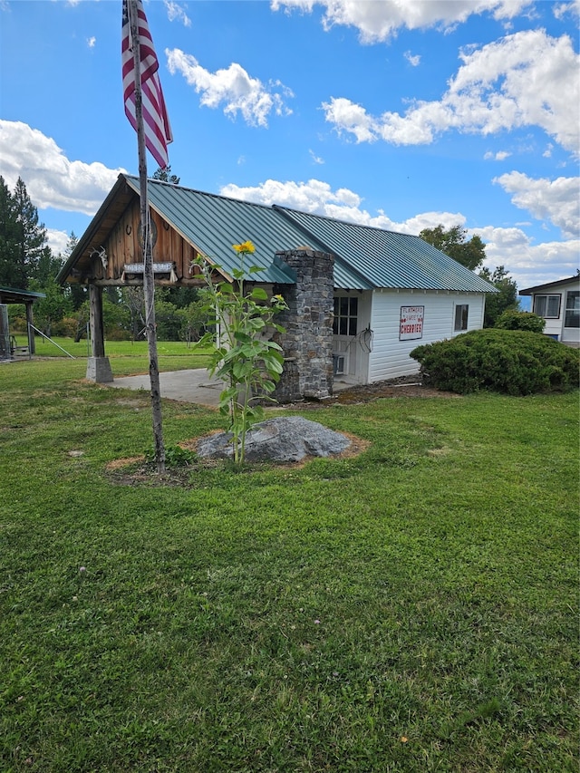 rear view of house with a lawn