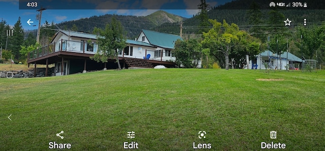 exterior space with a front yard and a deck