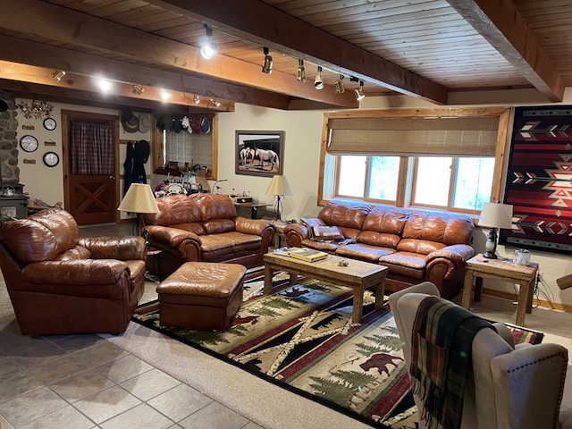 living room featuring tile patterned floors, beamed ceiling, rail lighting, and wooden ceiling