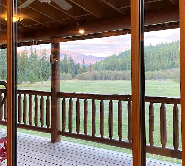 wooden deck featuring ceiling fan