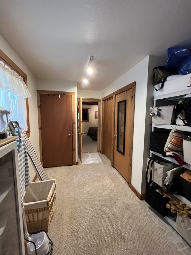 hallway with light carpet