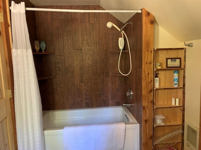 bathroom with shower / tub combo with curtain