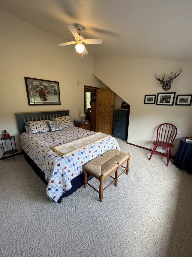 bedroom featuring ceiling fan, carpet, and vaulted ceiling