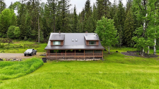 back of property featuring covered porch