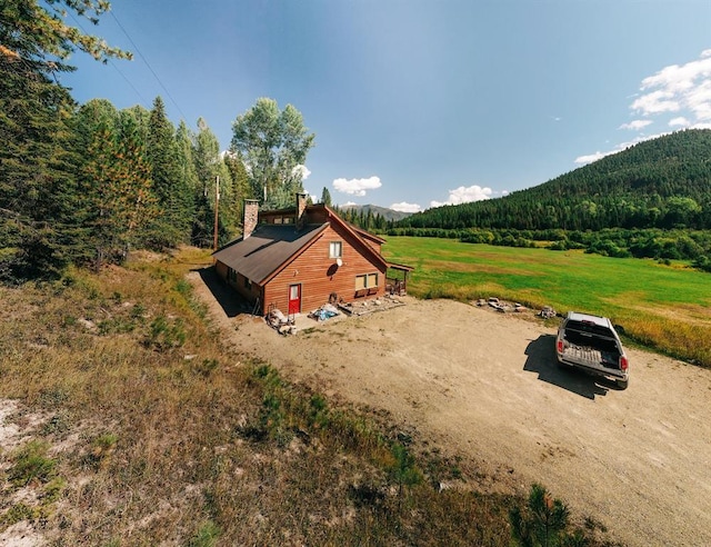 exterior space with a mountain view and a rural view