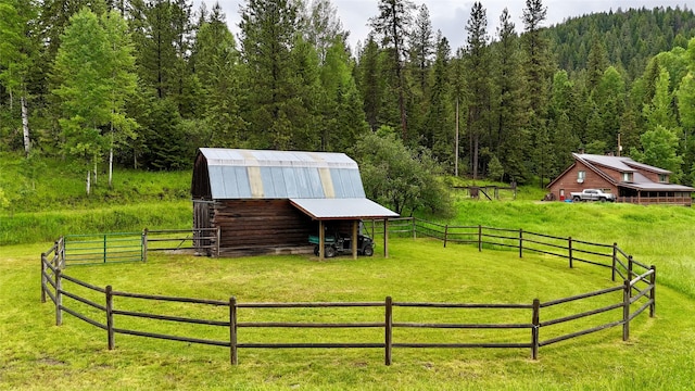 surrounding community with a rural view and an outdoor structure