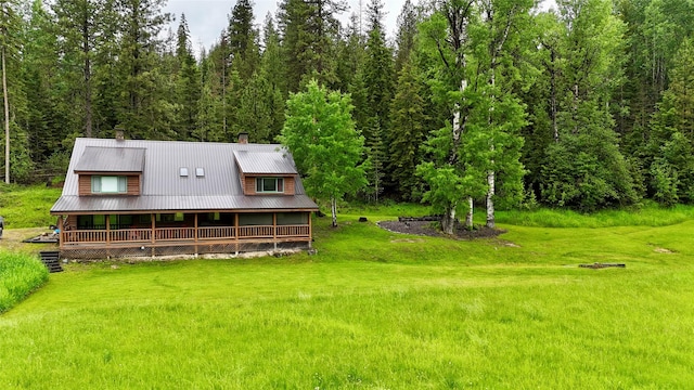 rear view of house with a yard