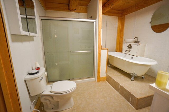 bathroom featuring a shower with door, tile flooring, and toilet