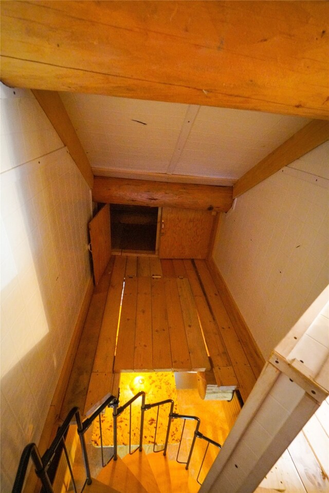 stairway with light wood-type flooring