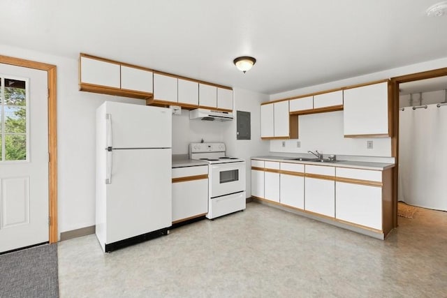 kitchen with white appliances, light countertops, under cabinet range hood, and white cabinets