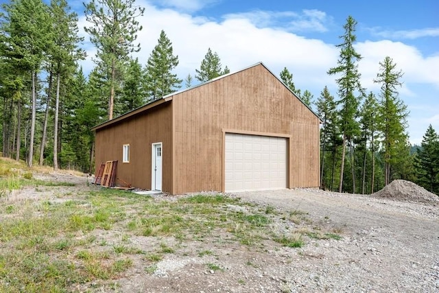 detached garage featuring driveway