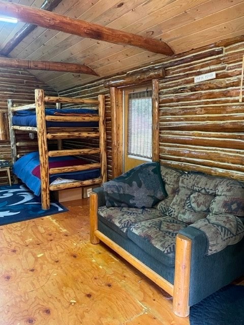 bedroom with rustic walls, wooden ceiling, and beamed ceiling